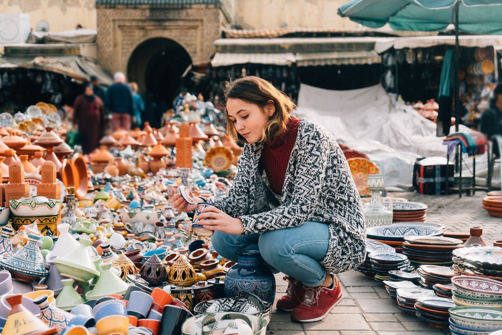 woman shopping ceramics in morocco