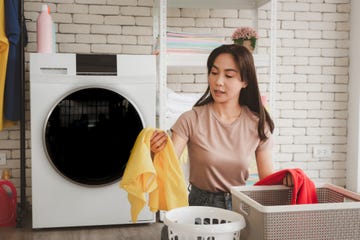 woman cleaning clothes at laundry