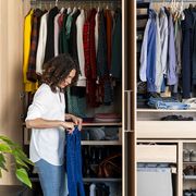 woman cleaning organized closet