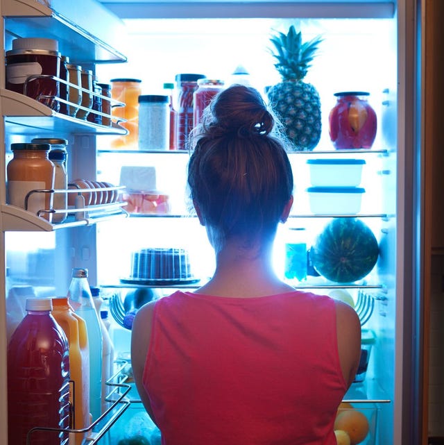 Woman Contemplating Midnight Snack late Night with Open Refrigerator