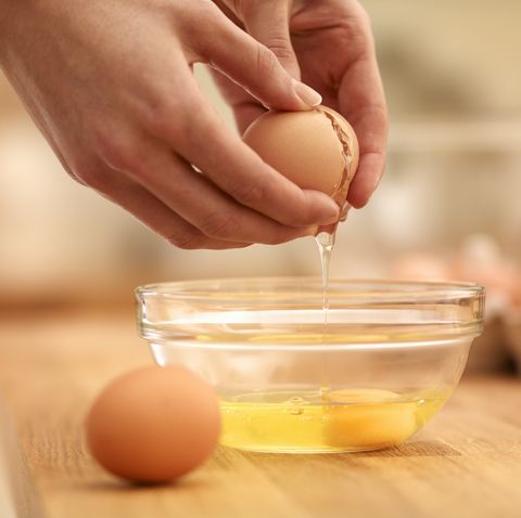 woman cracking egg