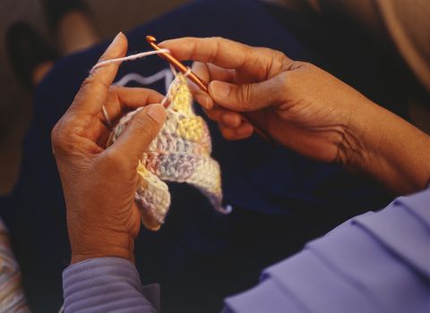 woman crocheting, close up of hand