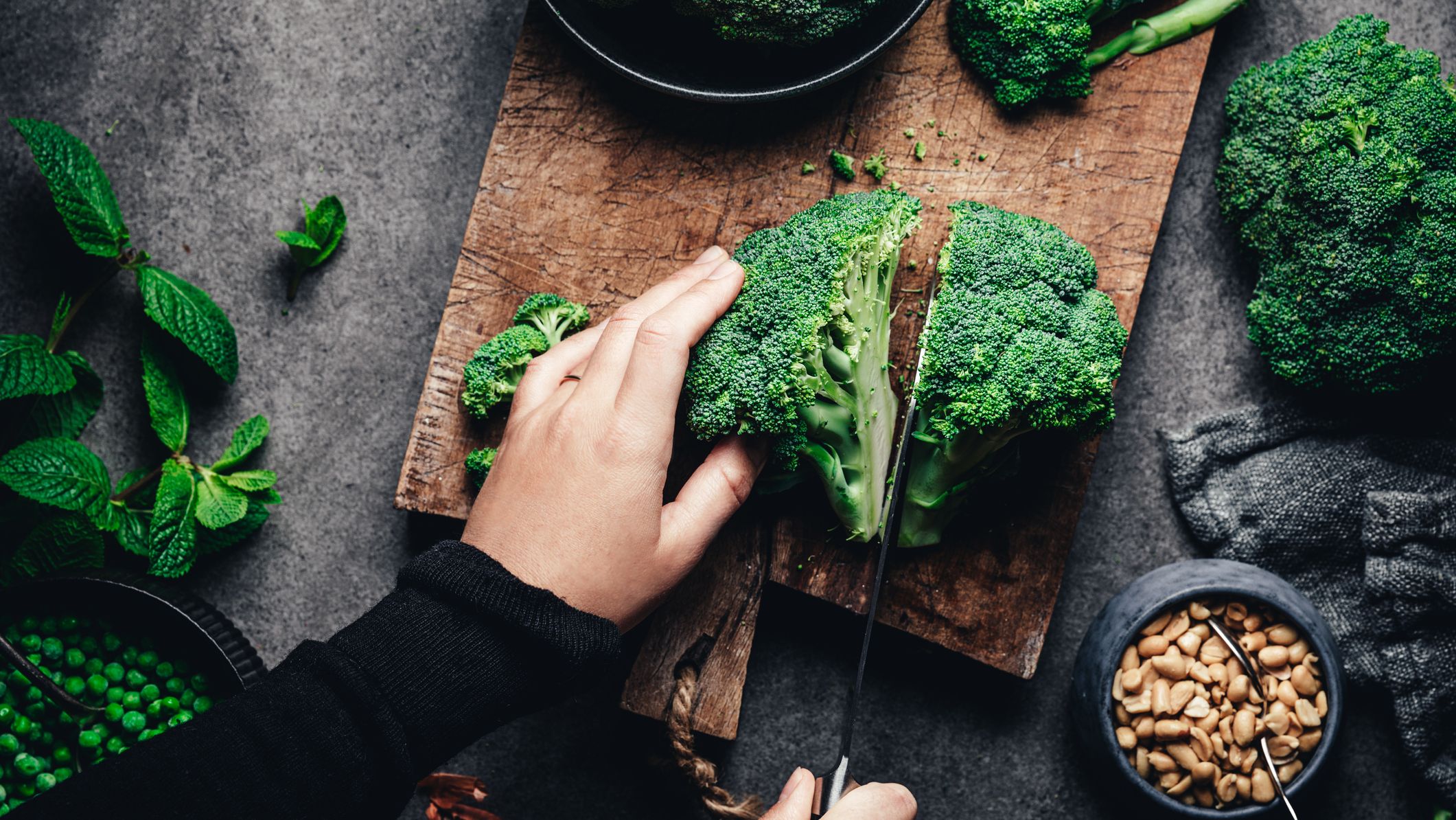 https://hips.hearstapps.com/hmg-prod/images/woman-cutting-fresh-broccoli-royalty-free-image-1640790688.jpg?crop=1xw:0.84415xh;center,top