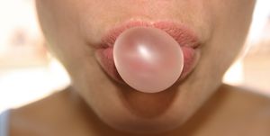 woman doing chewing gum bubble