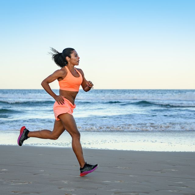 woman doing sports training drill on the beach