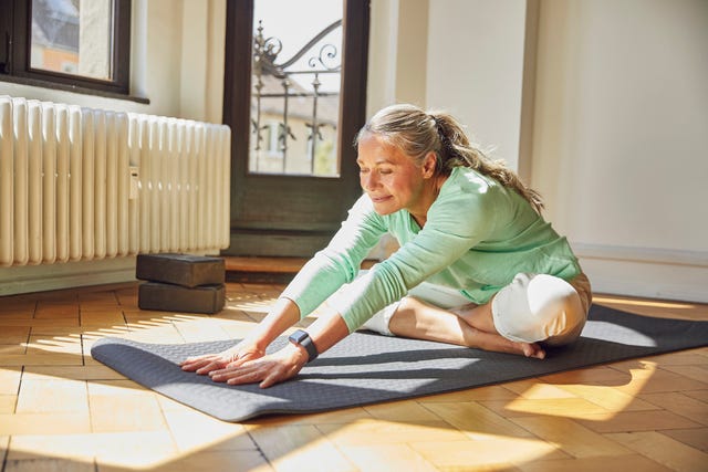 older woman doing yoga