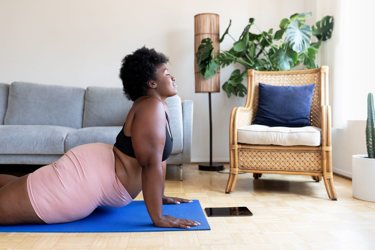 Tired Plus Size Black Woman Lying on Yoga Mat Near Laptop, Wiping Forehead  after Strength Training at Home Stock Image - Image of coronavirus,  fatigue: 245360505