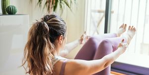 woman doing yoga exercises at home