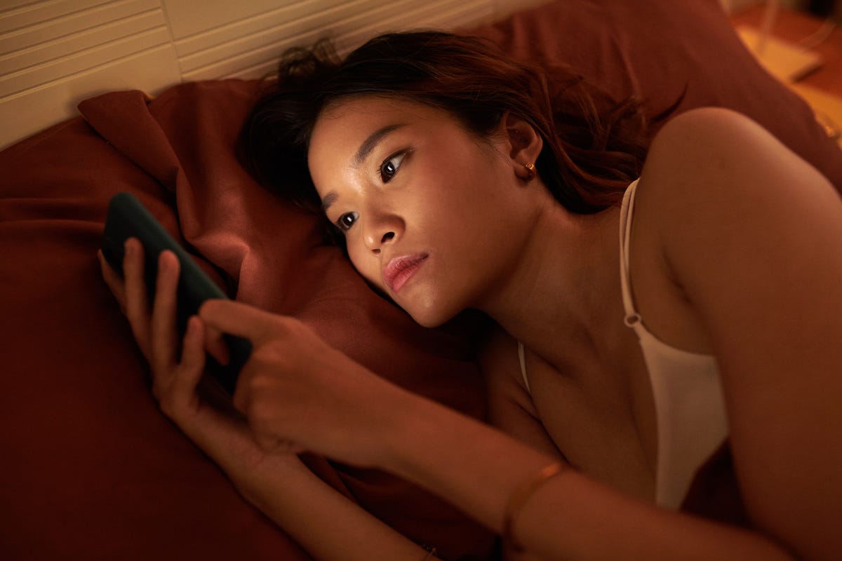 woman doomscrolling social media