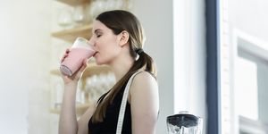 woman drinking a meal replacement shakes