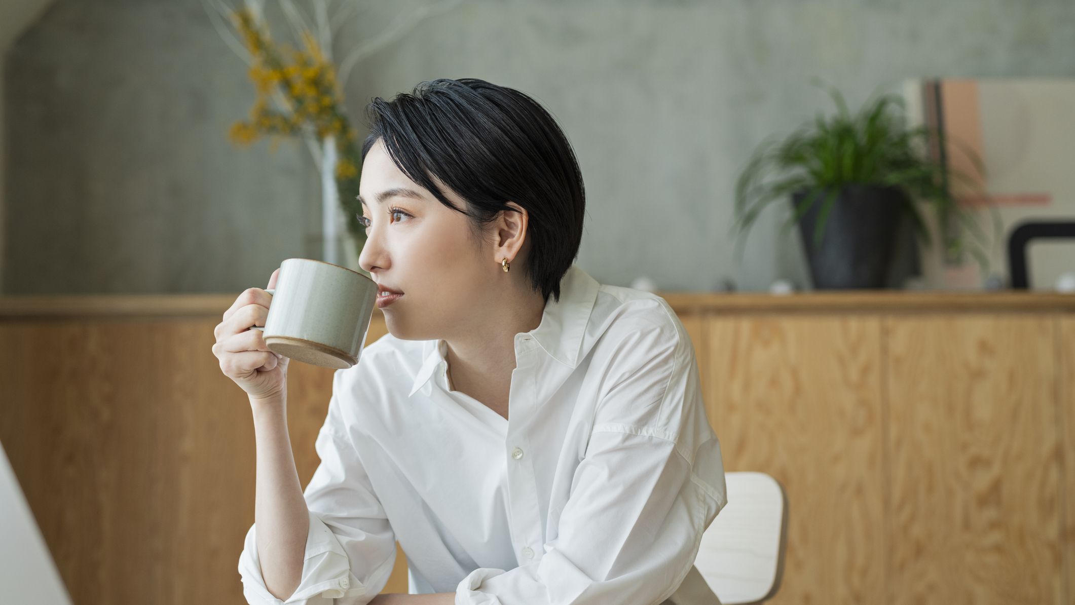 https://hips.hearstapps.com/hmg-prod/images/woman-drinking-coffee-while-working-remotely-royalty-free-image-1647375294.jpg?crop=1xw:0.84415xh;center,top