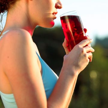 woman drinking cranberry juice