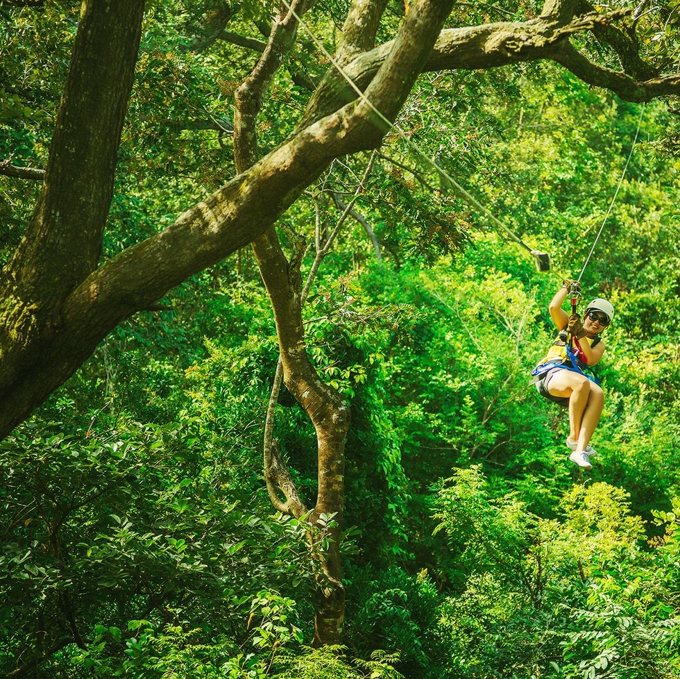 woman during a canopy tour costa rica