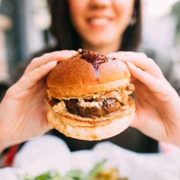 woman eating beef burger