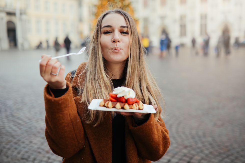 woman eating belgium waffles