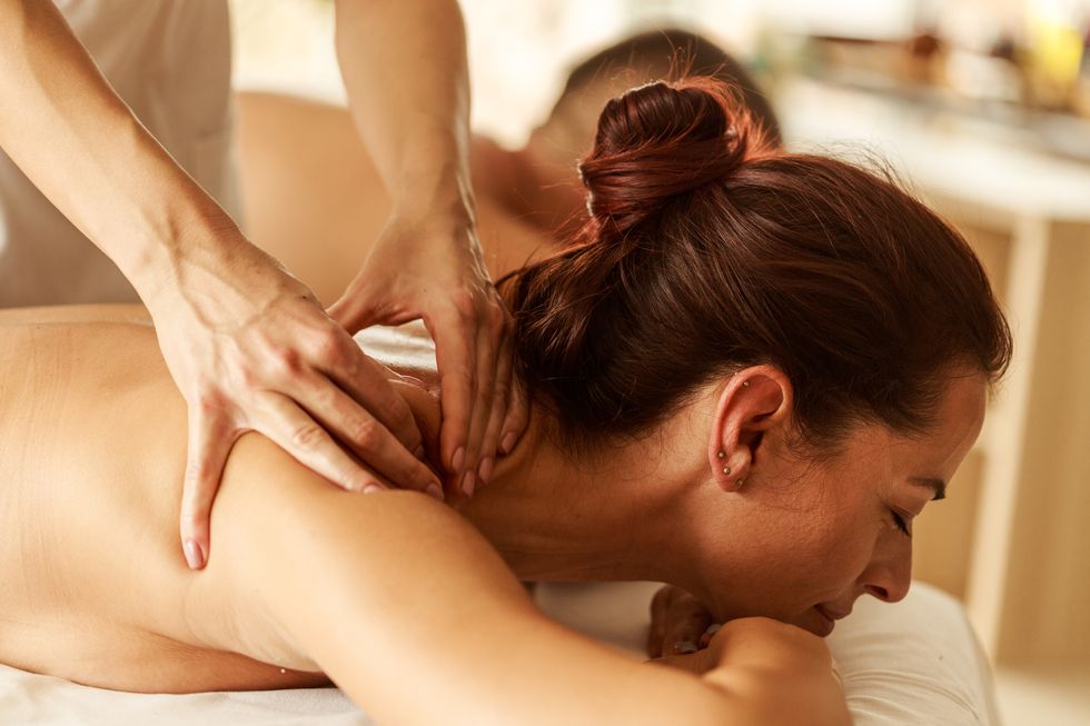 woman enjoying a therapeutic neck massage