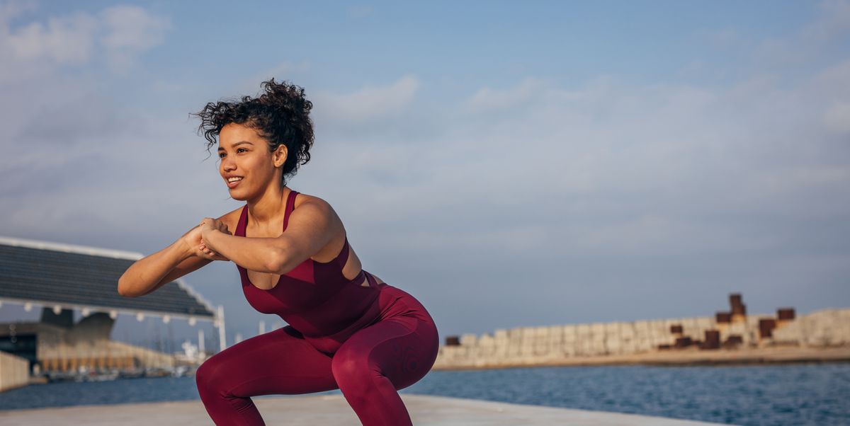 https://hips.hearstapps.com/hmg-prod/images/woman-exercising-by-the-sea-royalty-free-image-1755204223.pjpeg?crop=1.00xw:0.752xh;0,0.149xh&resize=1200:*