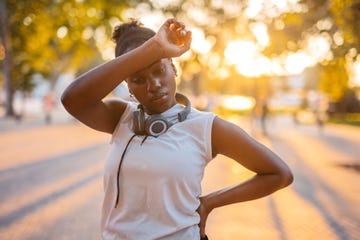 young woman exhausted exercising outside