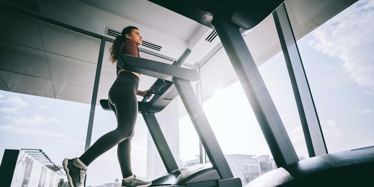 https://hips.hearstapps.com/hmg-prod/images/woman-exercising-on-treadmill-in-modern-gym-with-royalty-free-image-1752784092.pjpeg?crop=1.00xw:0.752xh;0,0.0721xh&resize=1200:*