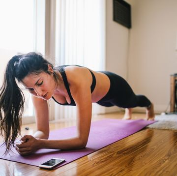 woman exercising planks at home in los angeles