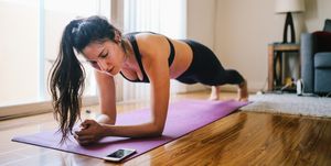 woman exercising planks at home in los angeles