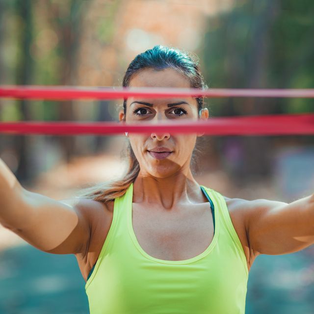 woman exercising with resistance band