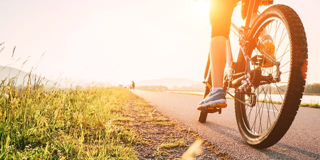 women cycle parts of half marathon 