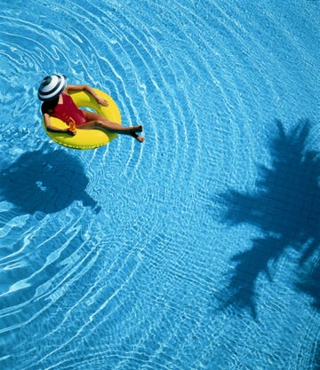 woman floating in pool on ring