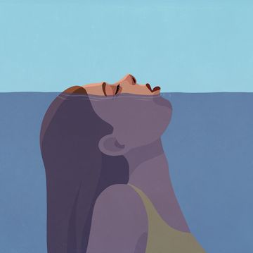 woman gasping for air above water