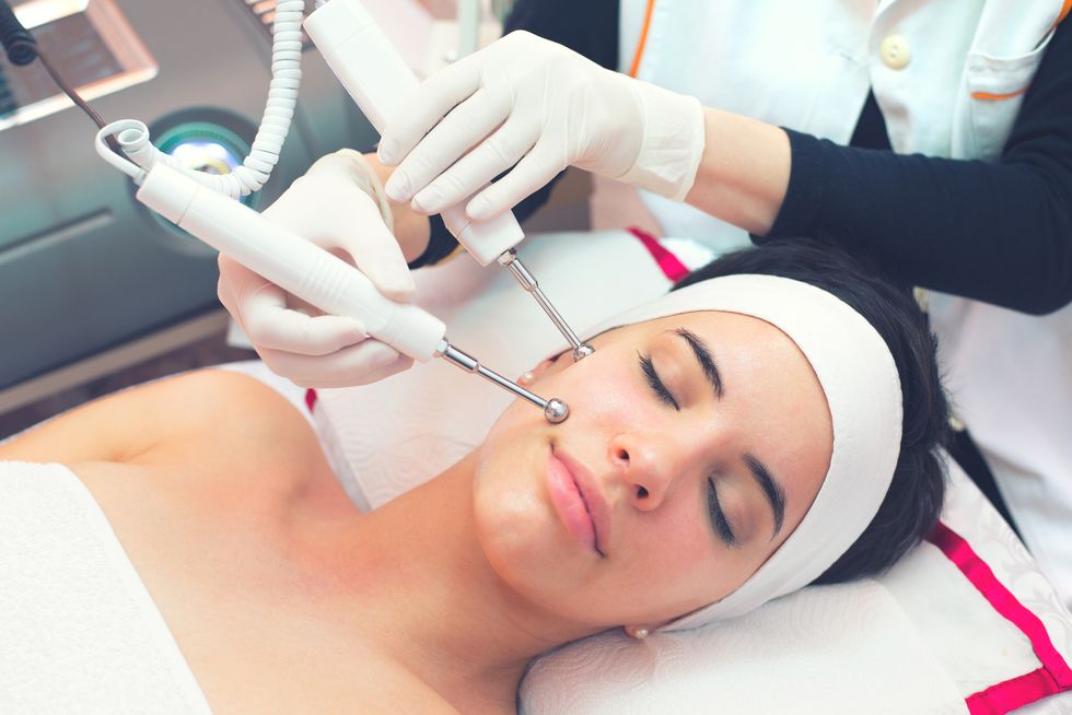 Woman getting beauty treatment in health spa