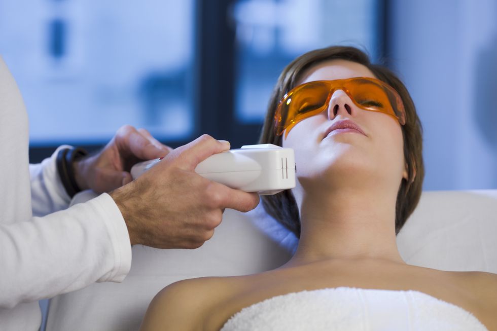 woman getting electrolysis treatment on her face