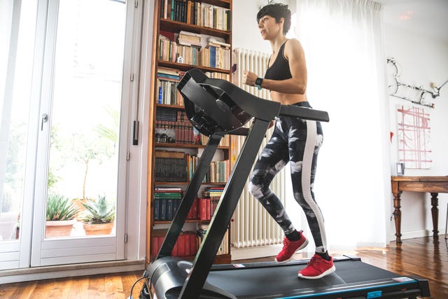 woman getting fit and doing home training in the living room