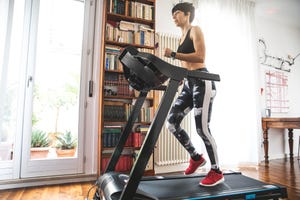 woman getting fit and doing home training in the living room