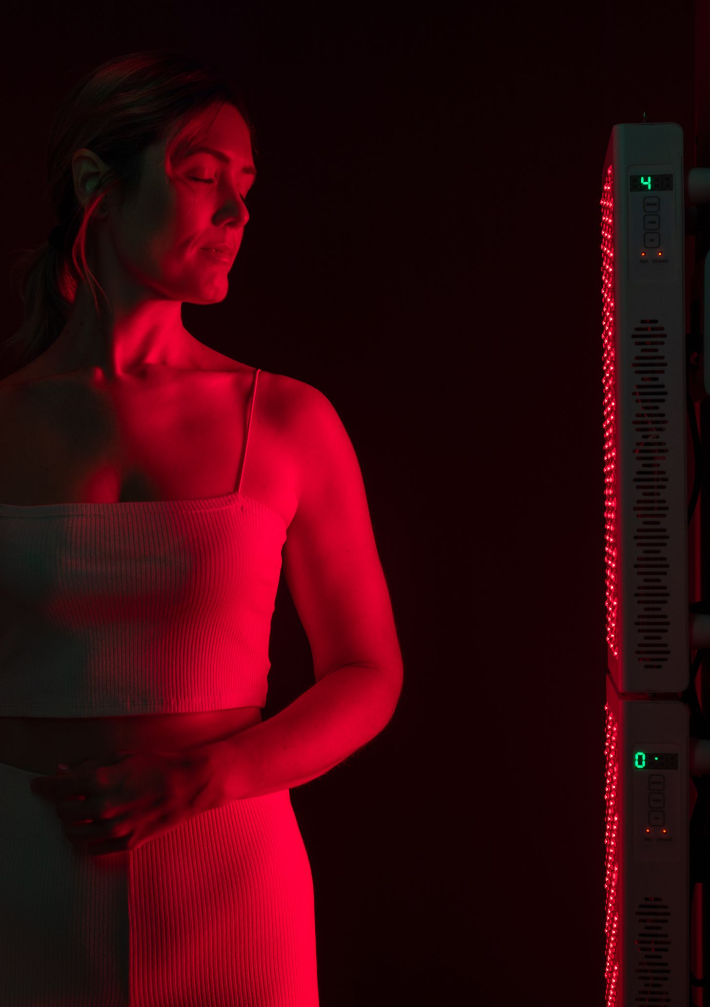 https://hips.hearstapps.com/hmg-prod/images/woman-getting-red-light-therapy-in-a-beauty-spa-royalty-free-image-1692820067.jpg