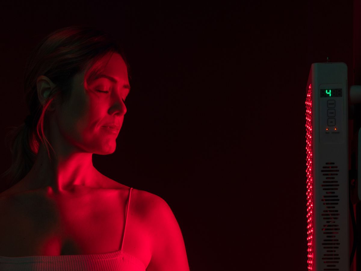 https://hips.hearstapps.com/hmg-prod/images/woman-getting-red-light-therapy-in-a-beauty-spa-royalty-free-image-1692820067.jpg?crop=1xw:0.52954xh;center,top&resize=1200:*
