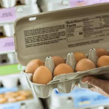 woman grocery shopping in store supermarket aisle