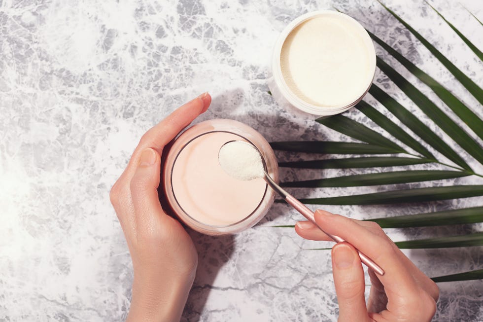 woman hands, collagen powder and smoothie