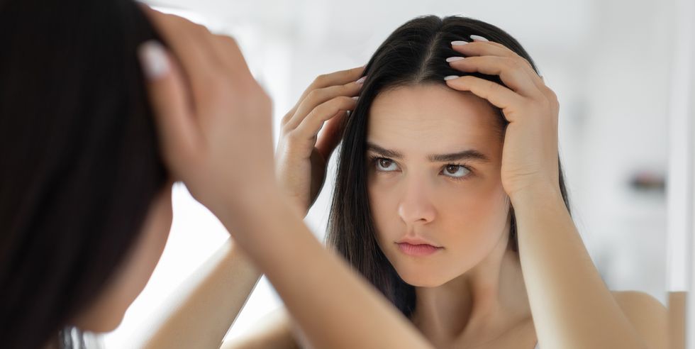 woman having problem with hair loss