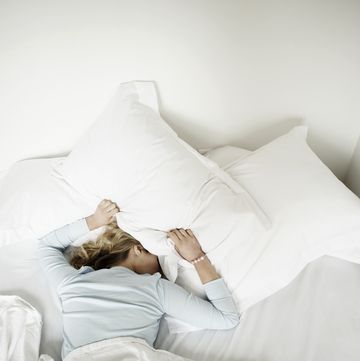 Woman having restless nights sleep