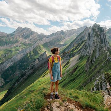 woman hiking in swiss alps in appenzell