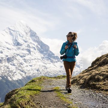 a woman hiking in the swiss alps