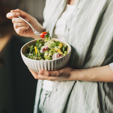 woman holding bowl with products for heart healthy diet, closeup
