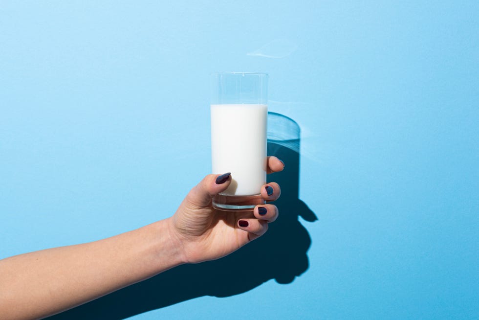 woman holding glass of milk