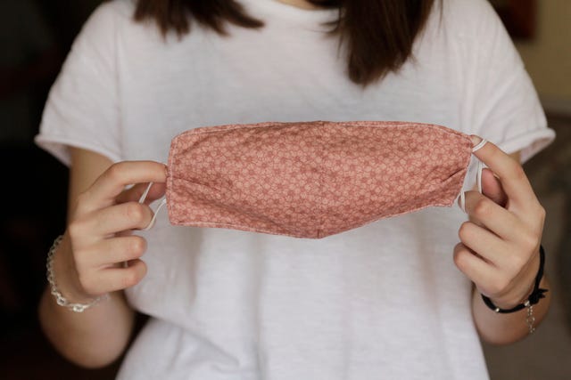 woman holding homemade face mask