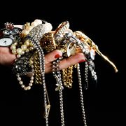 woman holding jewelry