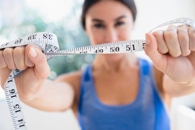 woman holding measuring tape