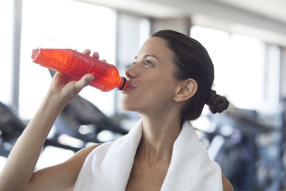 Woman hydrating after working out