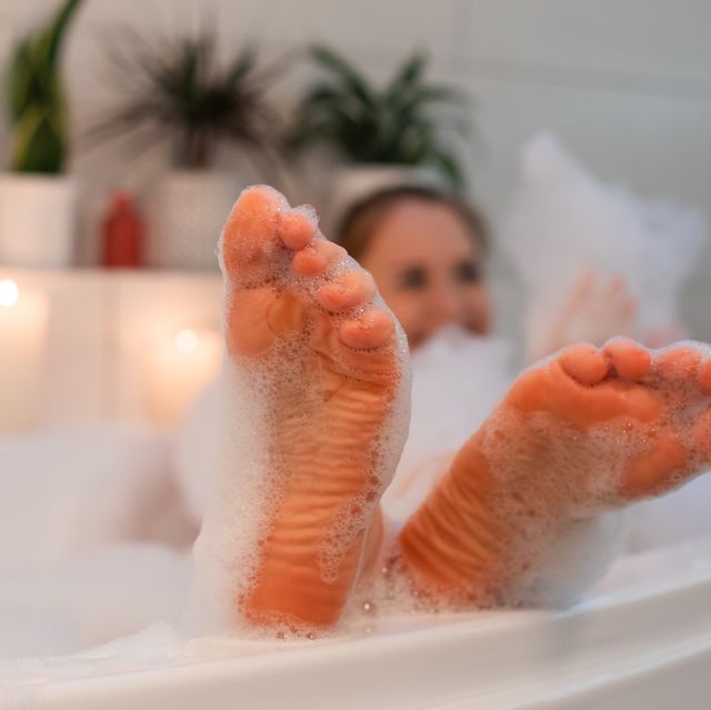 woman in bath with aroma foam
