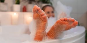 woman in bath with aroma foam