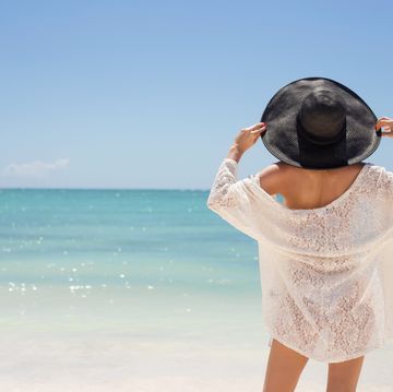 woman in summer hat on the beach